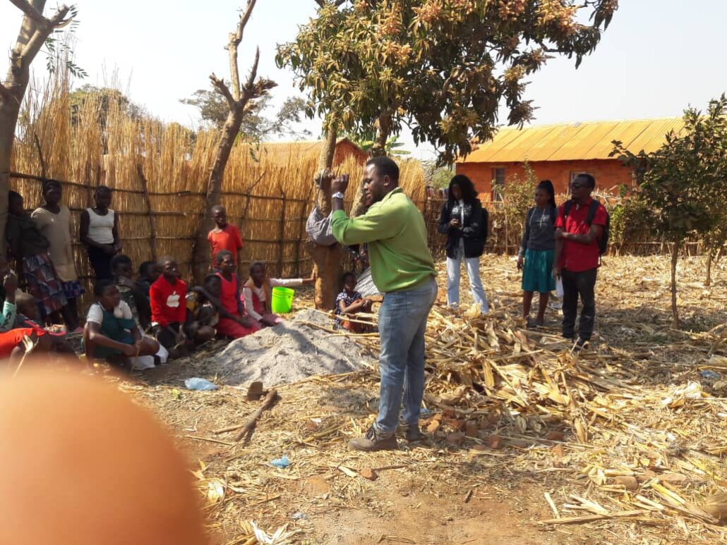 Field officer speaks to farming community gathered for workshop