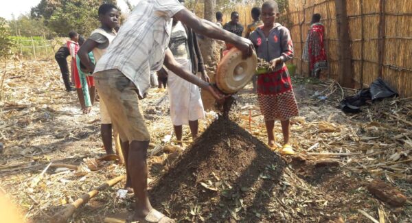 children working farm with organic manure