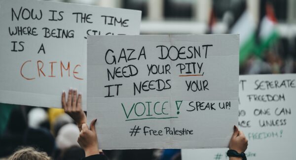 photo of sign from Palestine solidarity march. the sign reads: "Gaza doesn't need your pity. It needs your voice!"